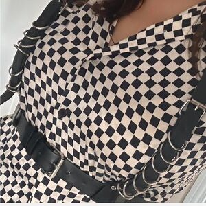 black faux leather harness with silver hardware accents